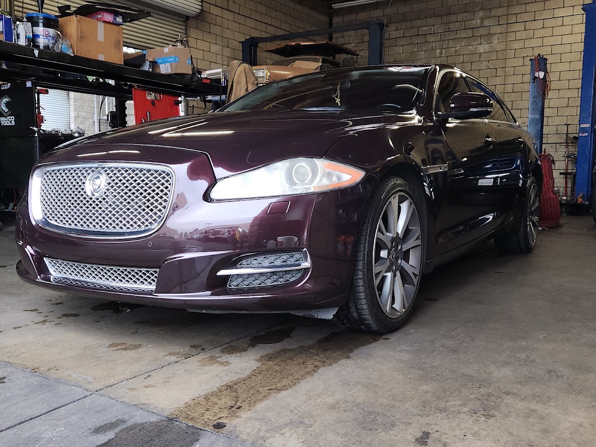 A Jaguar sedan in for service in the bay