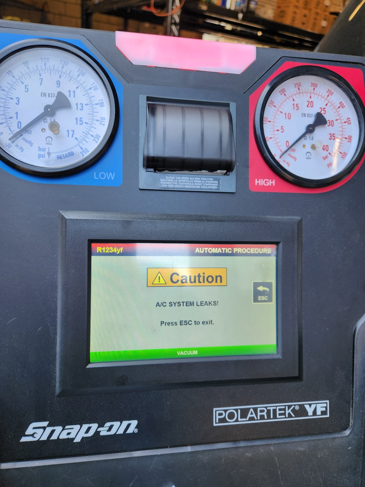 A/C system leak test on a Snap-on machine